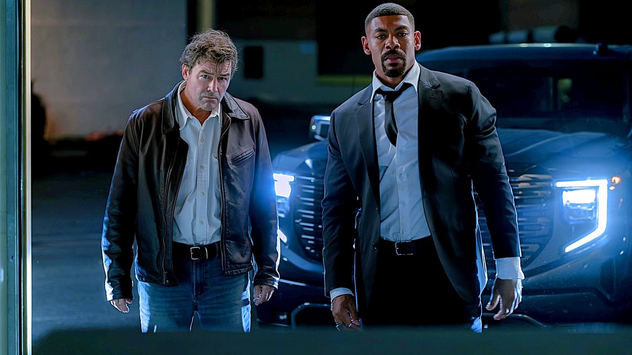 Halogram Jordan and John Stewart standing in front of a truck with headlights on from Lanterns The Jordan Boys' Legacy