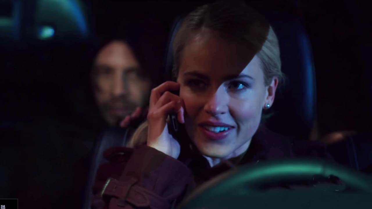 James Cole in back of car, Cassie Railly on the phone