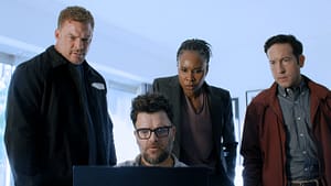 Jack Reacher, Russell Plum, Tamara Green, and Jacob Merrick standing in a room looking at a laptop from Reacher